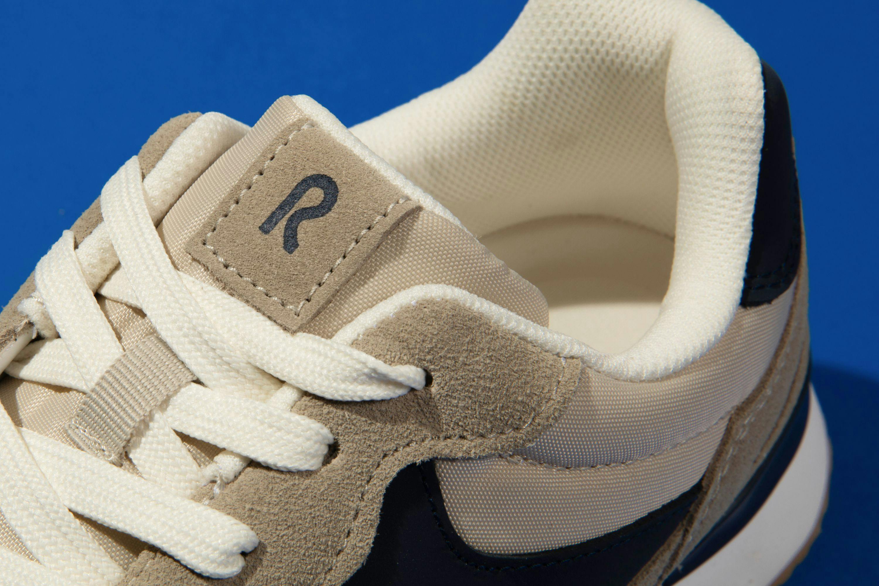 Close view of tongue and laces of R.O.W. branded shoe