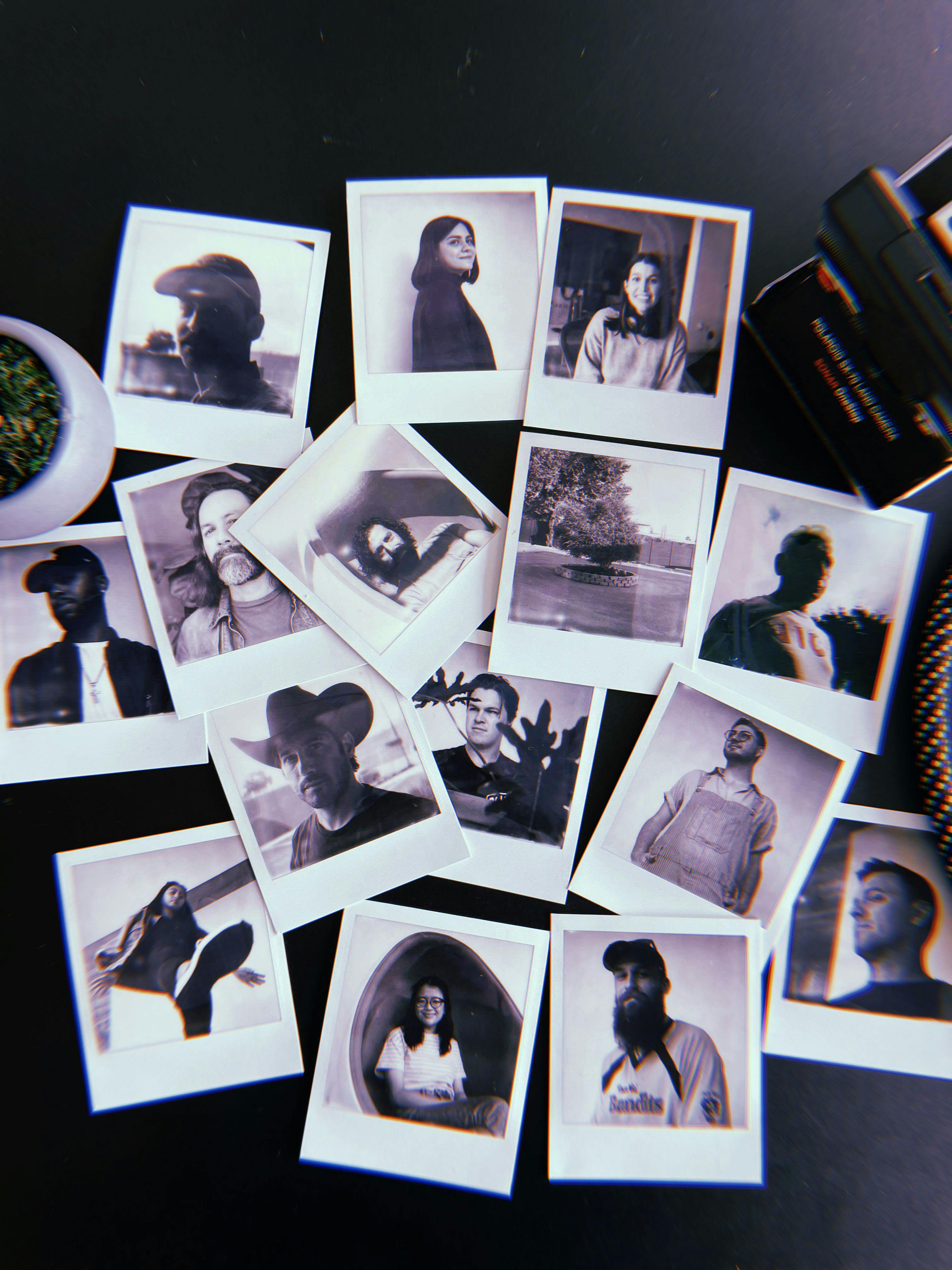 Polaroid photos of Tbeam crew next to a camera