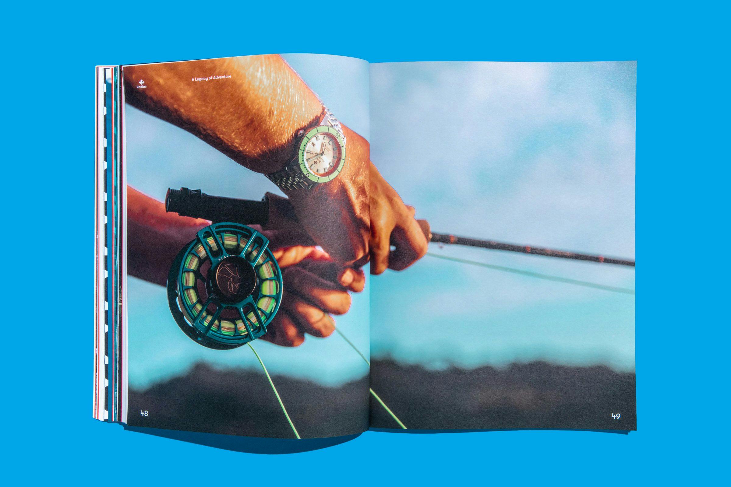 A two-page spread showing a photo of someone fishing with a Zodiac Watch on