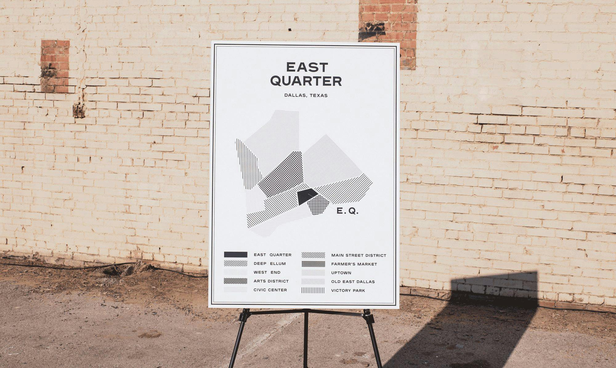 A map of East Quarter propped up in front of a brick wall