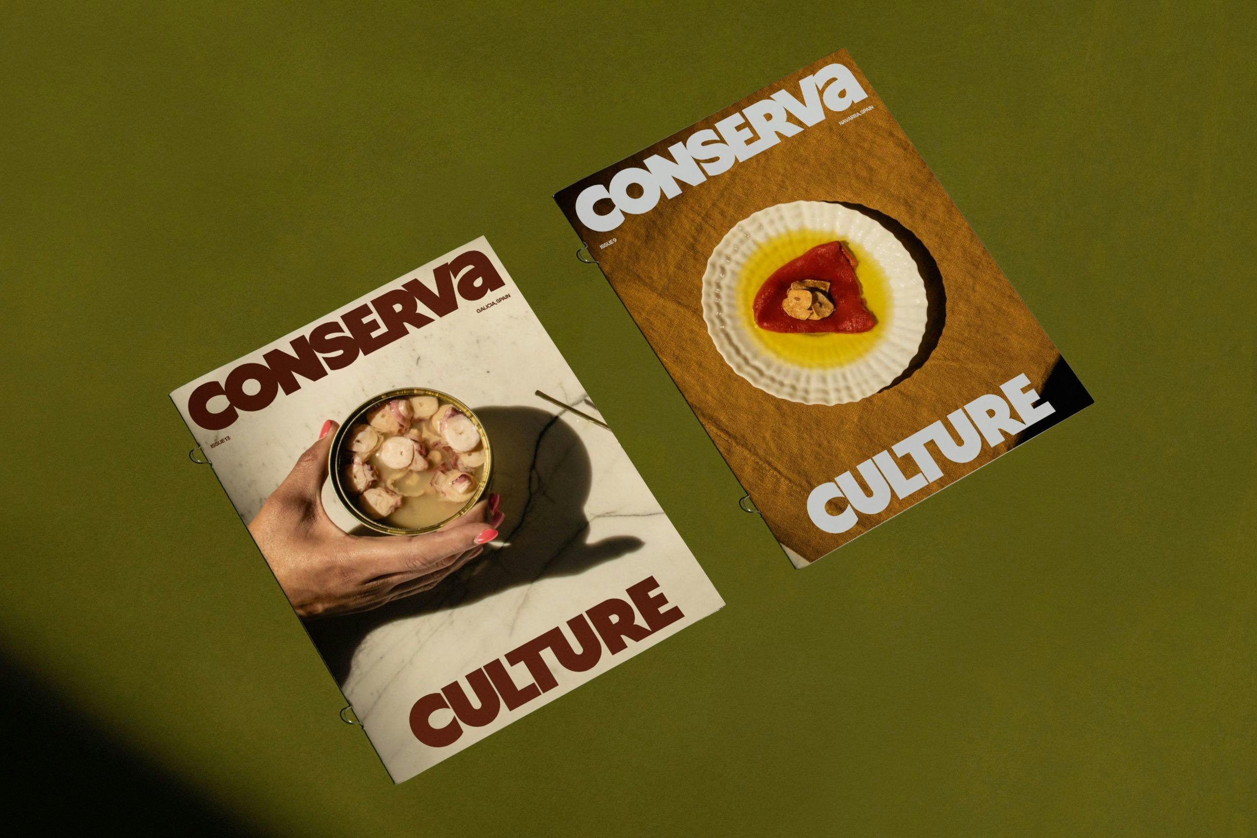 Conserva recipe guides sitting on a green table
