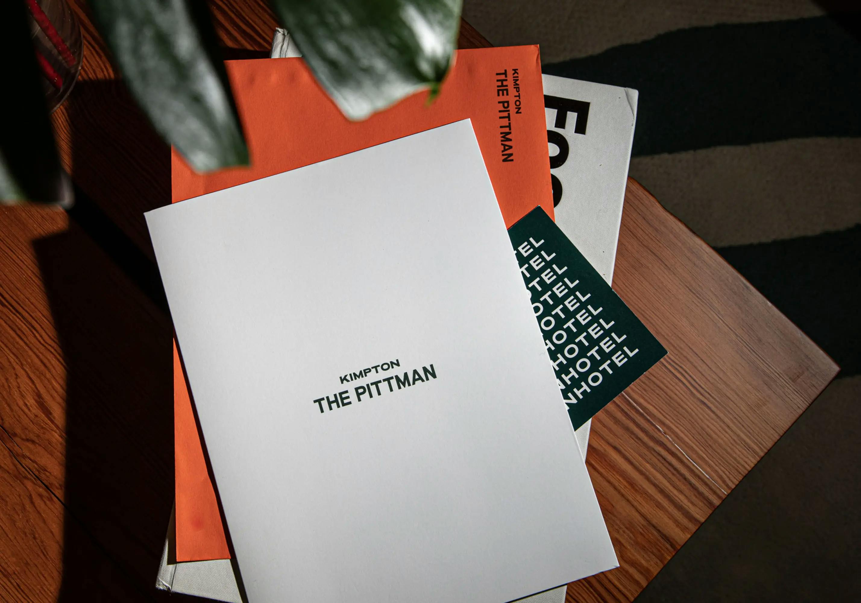 Stack of print assets for The Pittman in Deep Ellum