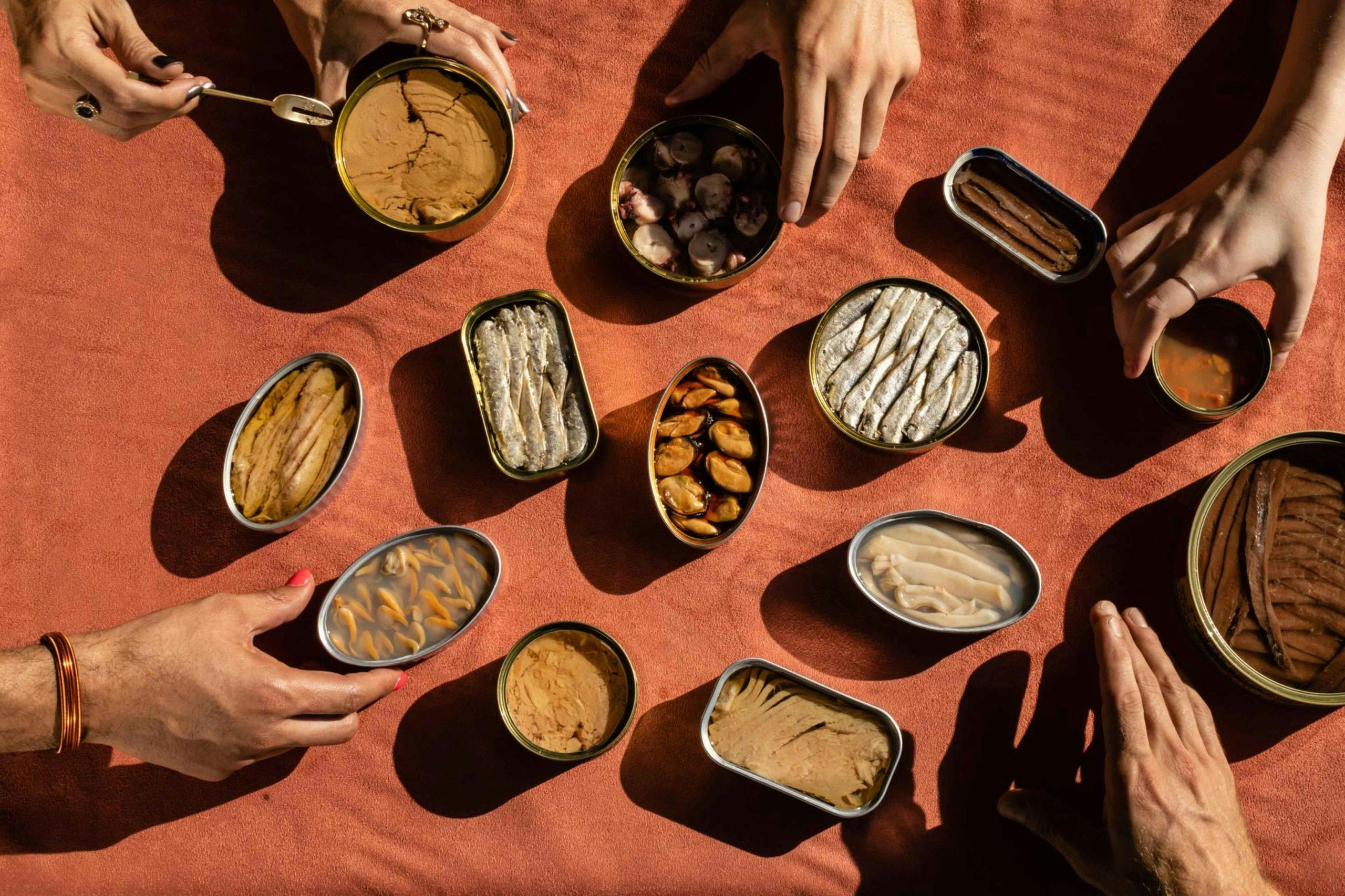 People gathered around a table sharing stylishly-packaged, shelf-stable foods