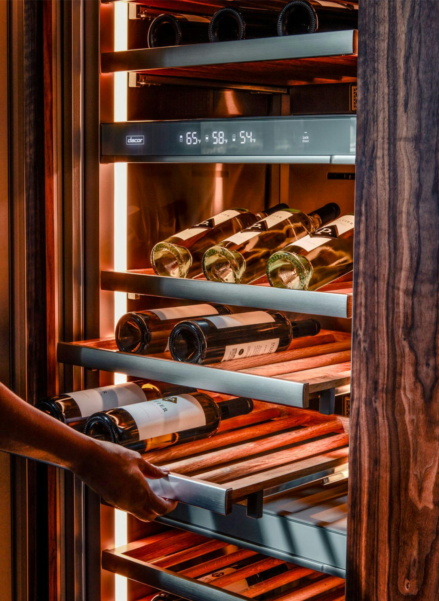 A wine refrigerator with slide out shelves