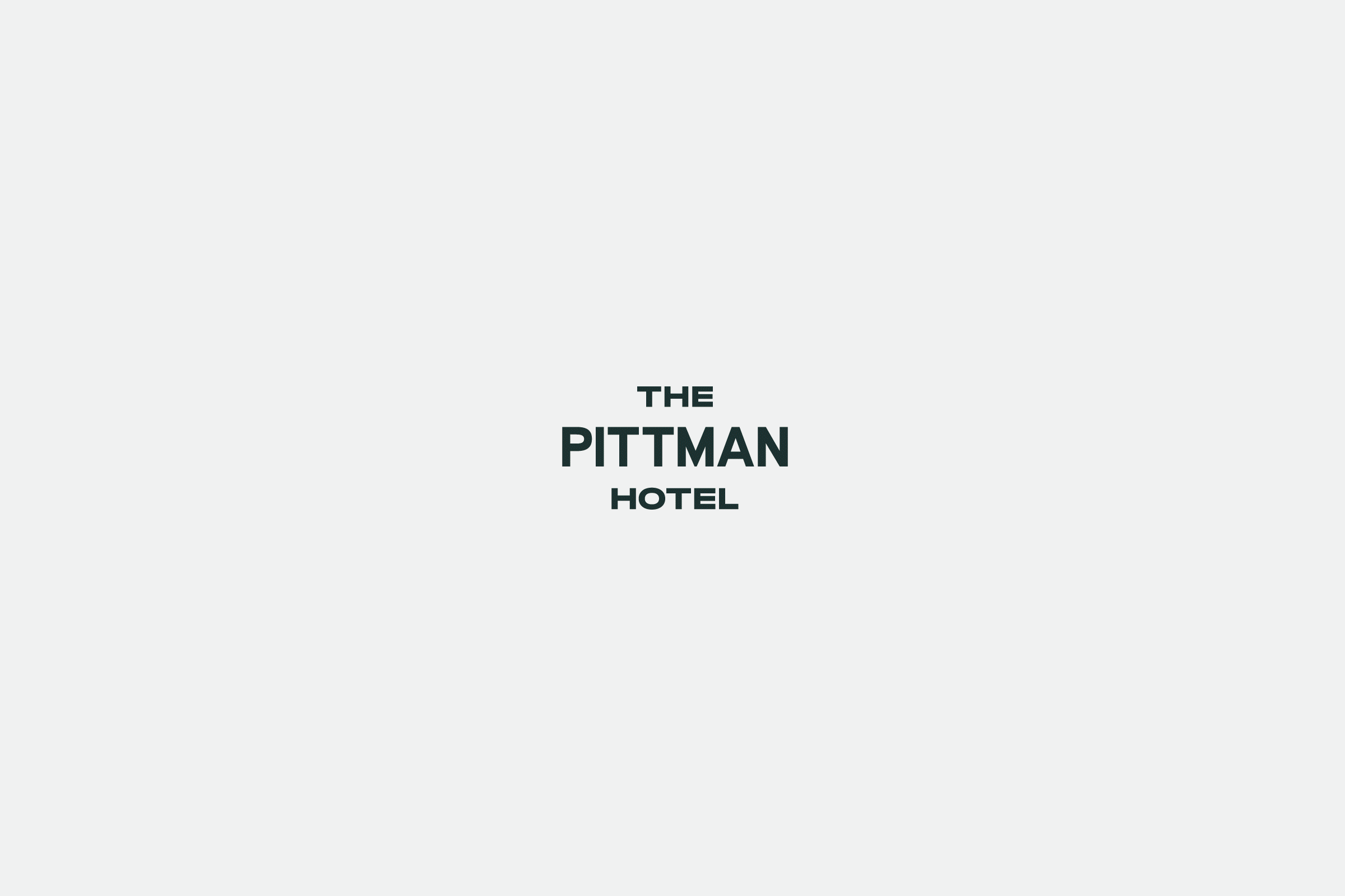 Animated graphic swapping between The Pittman Hotel logo and the hotel's facade