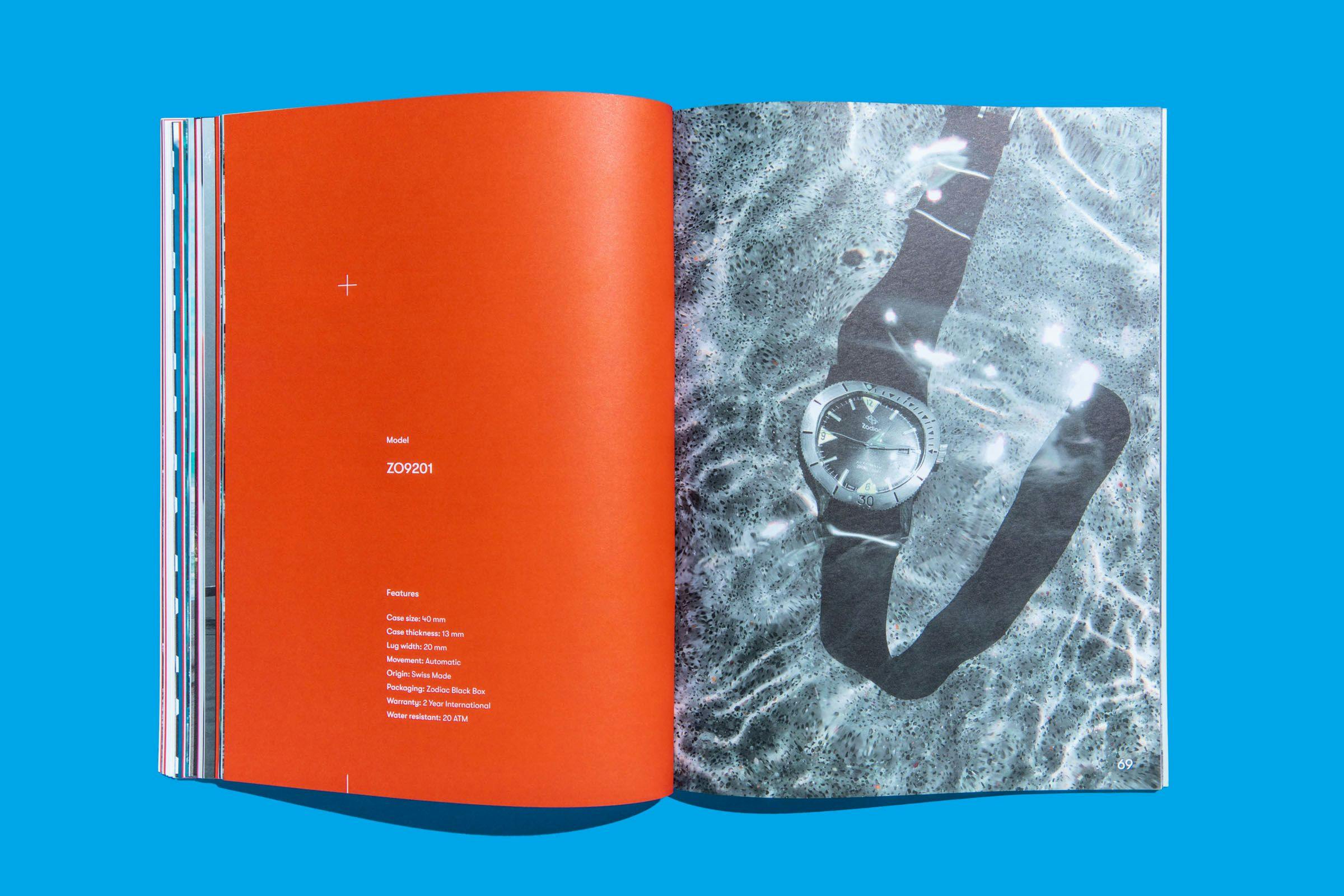 A vibrant orange page with white text and a page sized photo of a Zodiac Watch