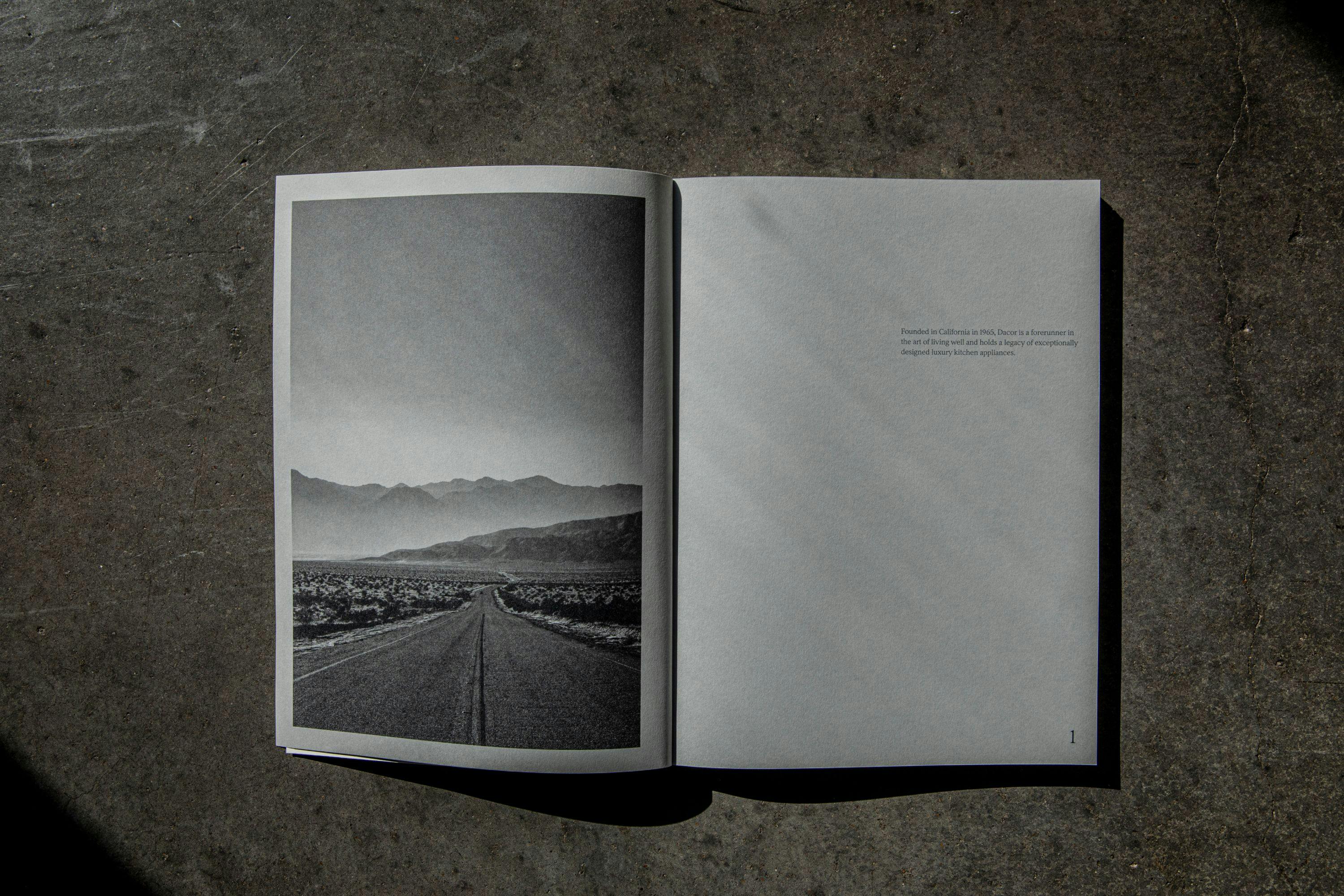 Black and white photo of a mountain road in a catalog