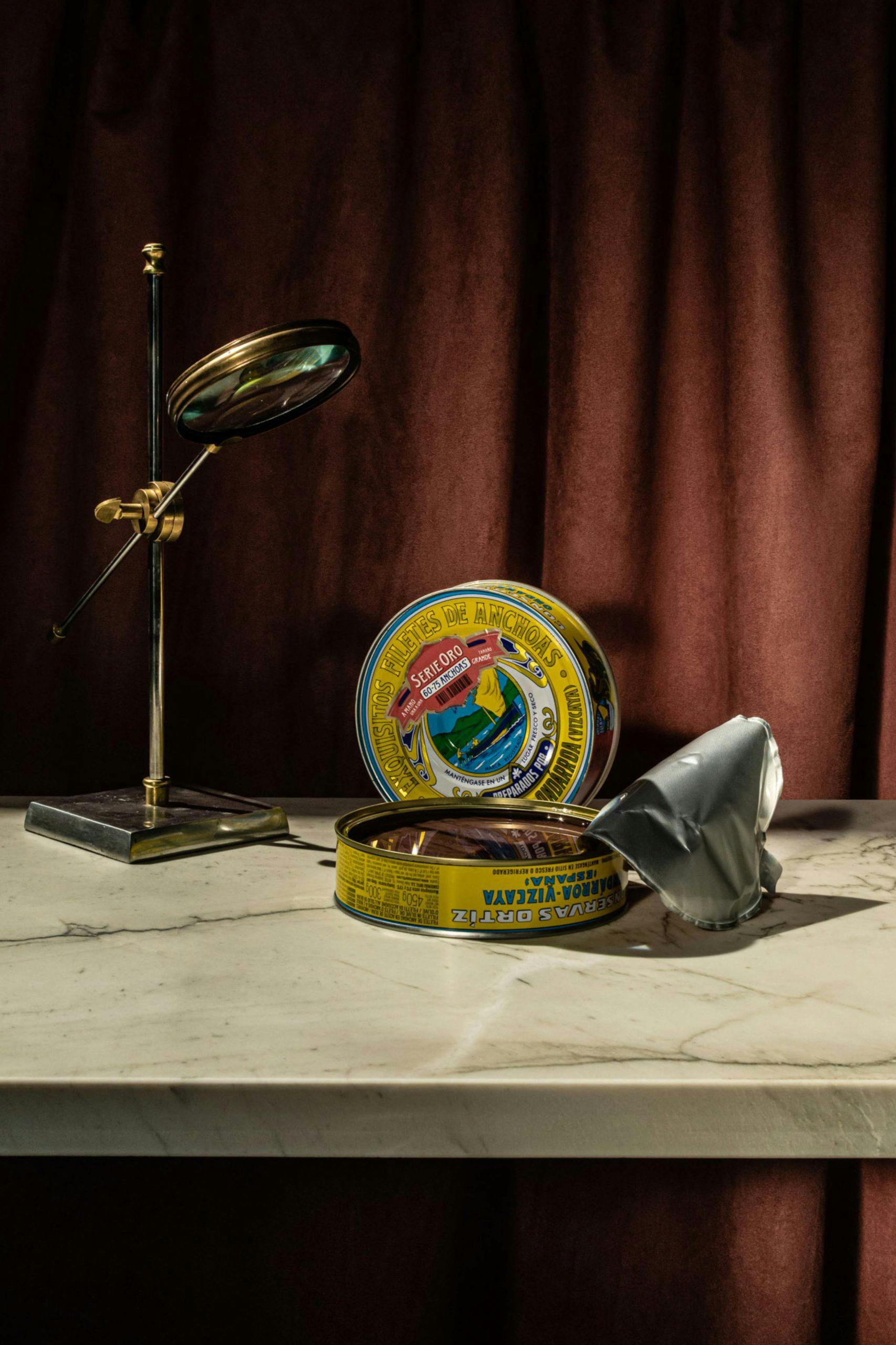Canned fish set on a marble table